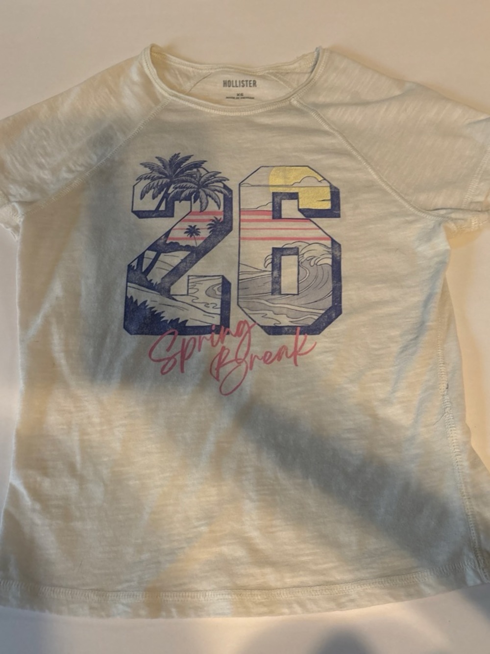 Hollister White Graphic '26 Spring Break' Tee with Blue, Yellow & Pink Accents